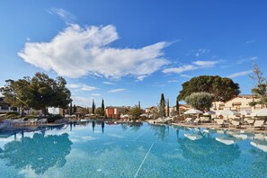 Indoor pool, outdoor pool, pool umbrellas, sun loungers