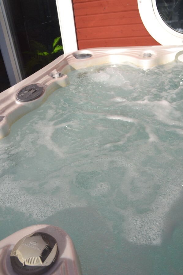 A hot tub with visible jets and a control panel. - Mellanfjardens Pensionat (Jättendal)