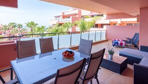 Outdoor dining - Beachside Apartment with Pools & Terrace Views (Estepona)