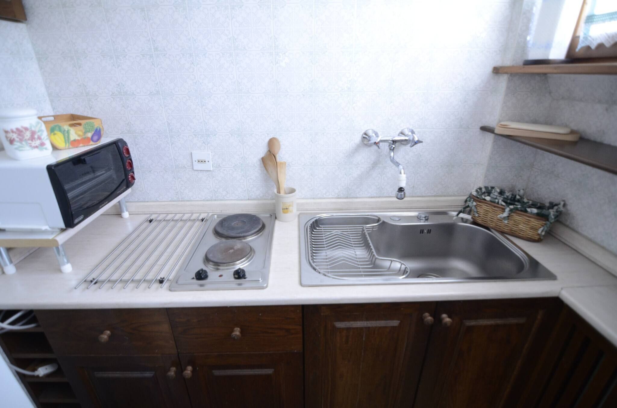 Fridge, stovetop, toaster, cookware/dishes/utensils