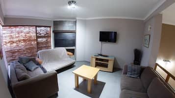 Flat-screen TV, fireplace