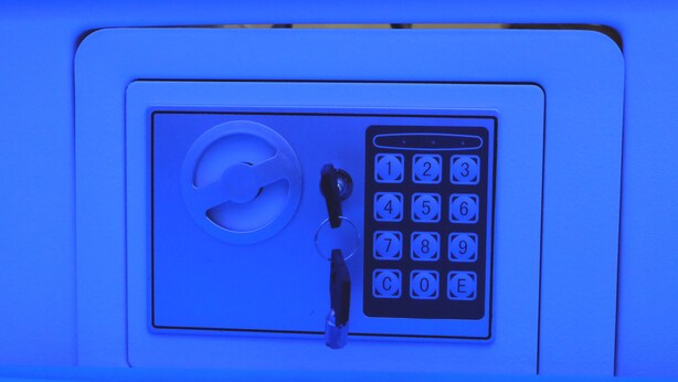 A keypad lock with a circular keyhole and a numeric keypad. - Capsule Inn Medan (Medan)