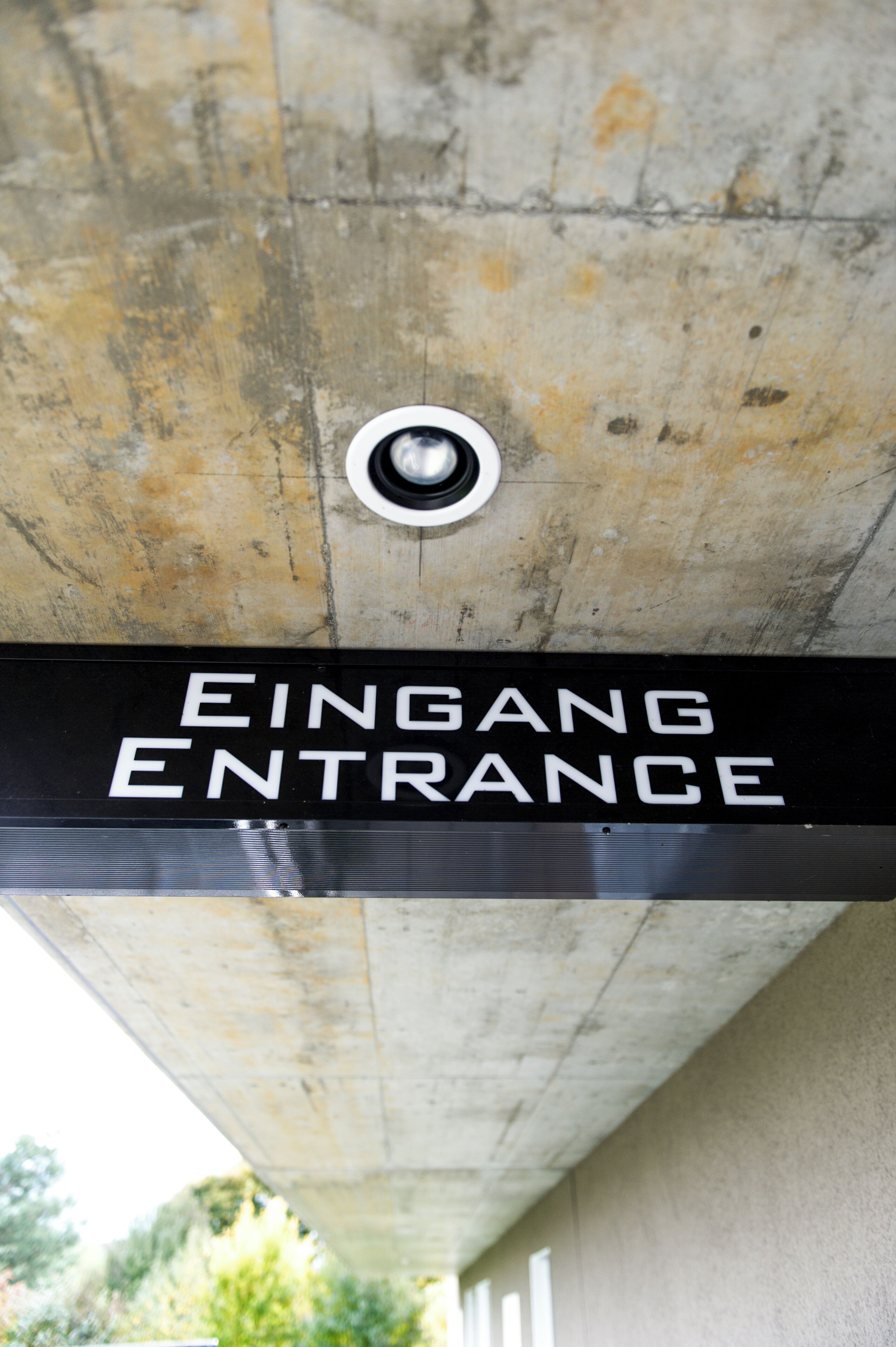 A sign indicating the entrance to a building.