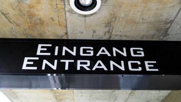 A sign indicating the entrance to a building.