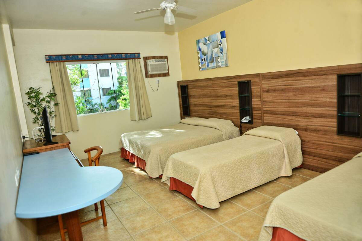 Deluxe Quadruple Room, Multiple Beds | 1 bedroom, minibar, in-room safe, desk