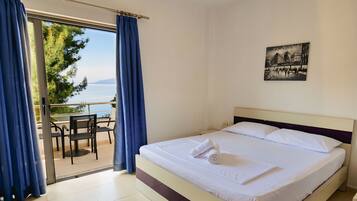 Family Room, Sea View | Individually furnished, desk, free WiFi, bed sheets