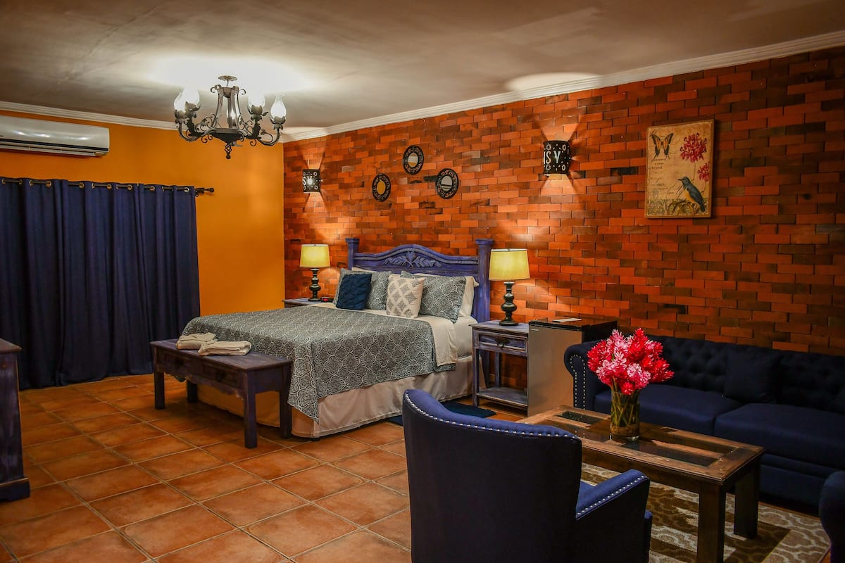 grand suite, 1 king bed, non smoking | desk, iron/ironing board, rollaway beds, free wifi