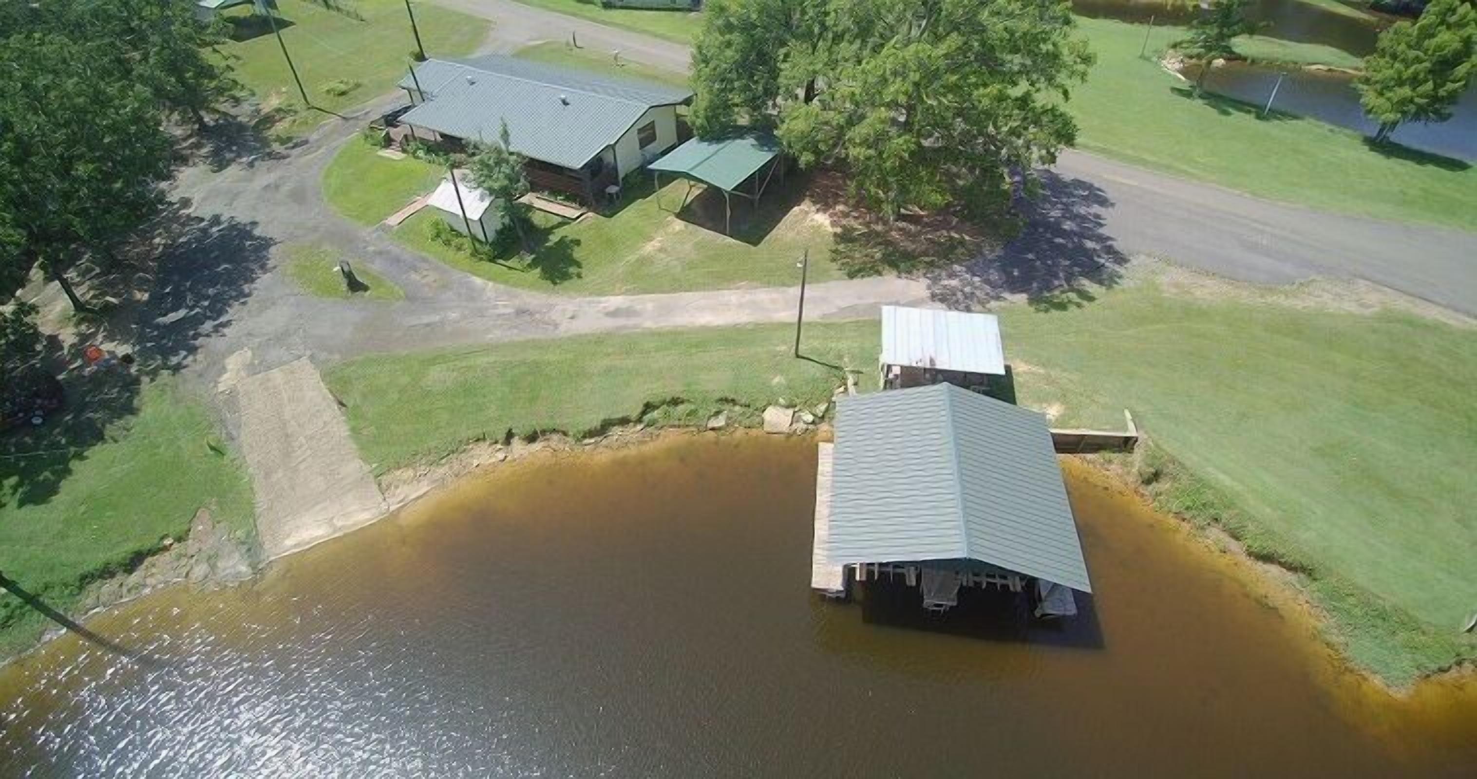 Historic 4 BR Lakefront House with boat house and boat ramp