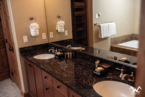 Bathtub, hair dryer, towels, soap