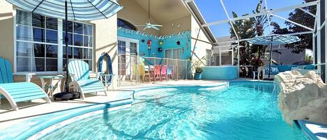 Outdoor pool, a heated pool, pool umbrellas