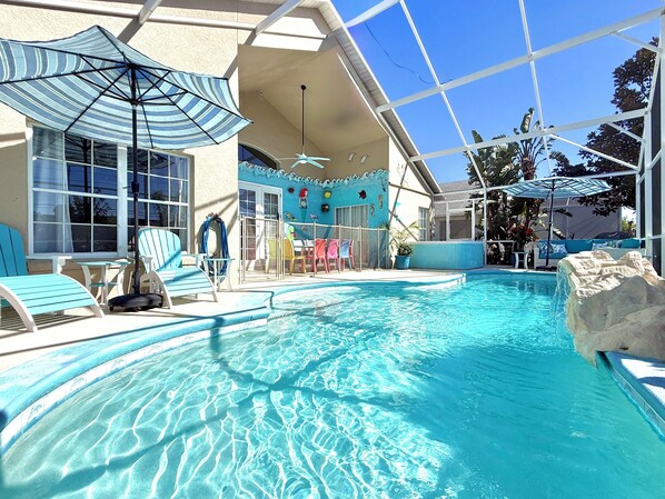 Outdoor pool, a heated pool, pool umbrellas