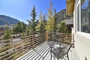 Enjoy breathtaking views of the surrounding mountains from this balcony.