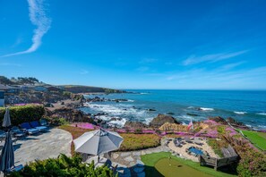 Enjoy ocean views from the patio, surrounded by a lush garden and a small putting green.