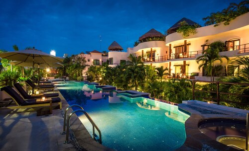 Steps from Beach,  Large private balcony overlooking pool & tropical garden