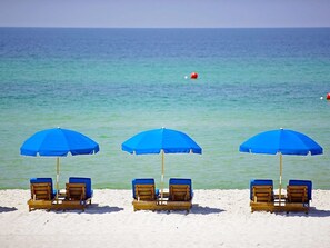 On the beach, sun-loungers, beach towels