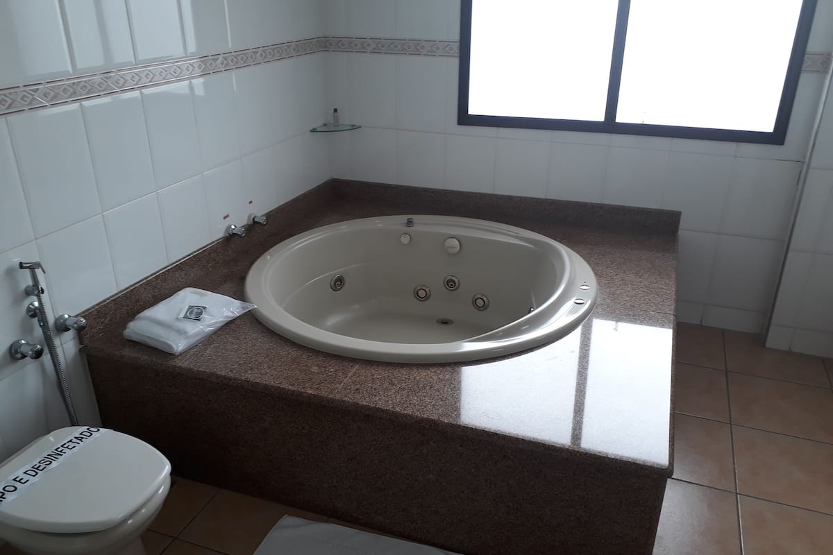 presidential suite, 1 king bed | bathroom | shower, rainfall showerhead, towels