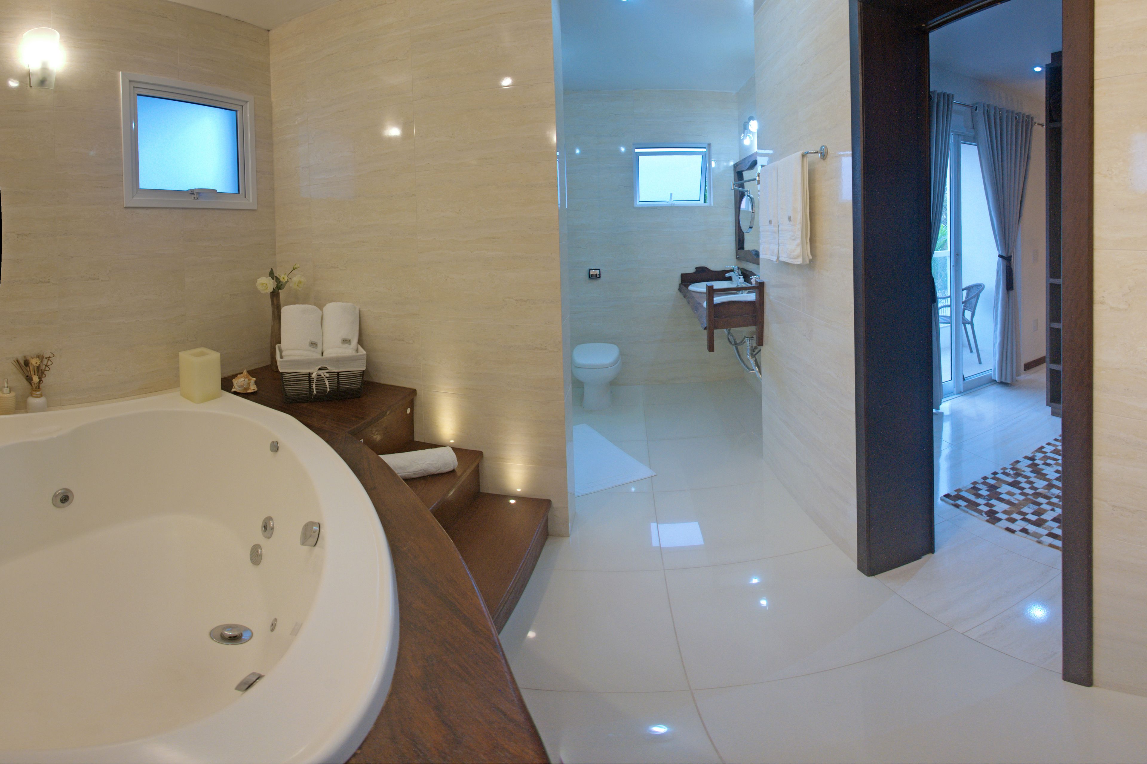 luxury suite, bathtub | bathroom | hair dryer, towels