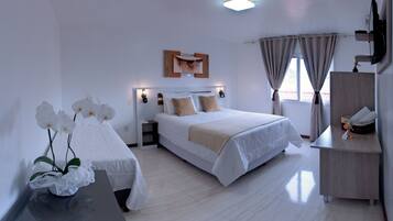 Deluxe Double Room | Minibar, desk, blackout drapes, iron/ironing board