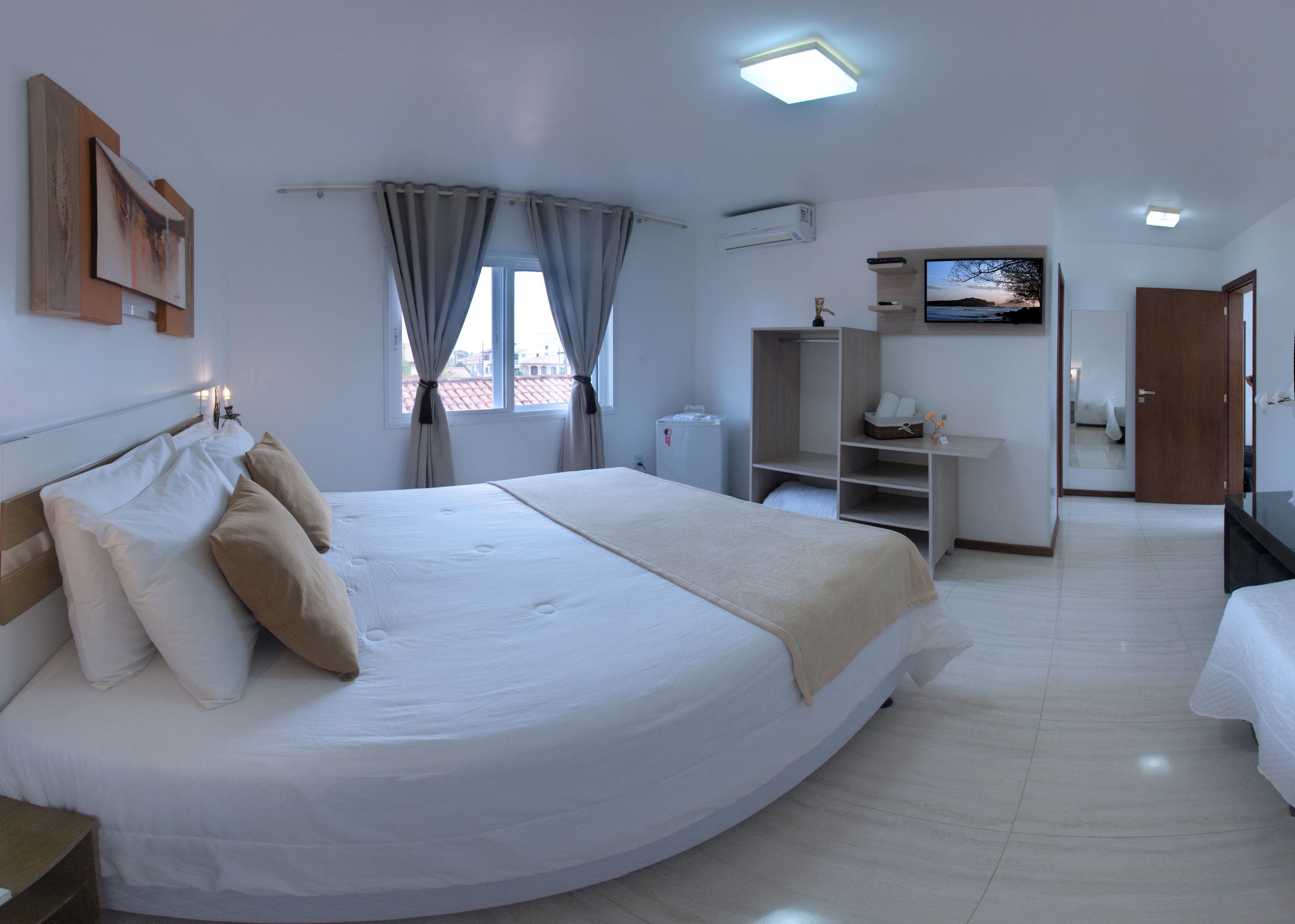 deluxe double room | minibar, desk, blackout curtains, iron/ironing board