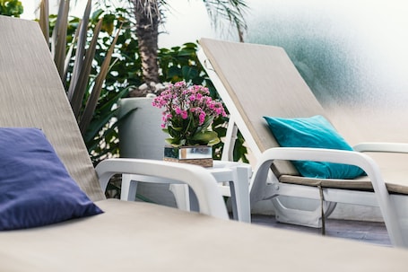 Outdoor pool, open 10:00 AM to 10:00 PM, pool umbrellas, sun loungers