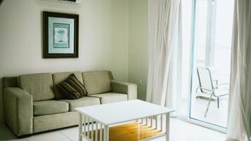 Deluxe Suite | Living room | Flat-screen TV