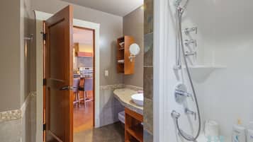 A bathroom with a bathtub, toilet, and sink.