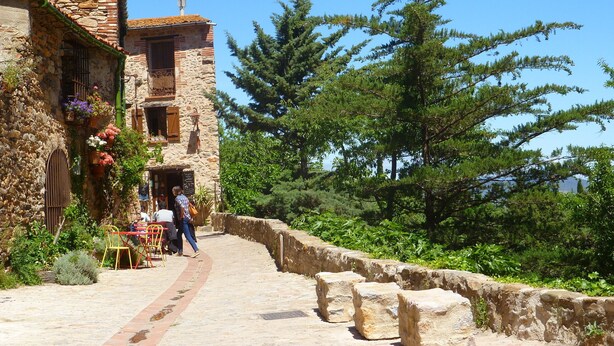 A stone building with a rustic charm, featuring a stone staircase leading to a wooden door. - Spacious Three Bedroom Mountain Villa with Pool (Serdinya)
