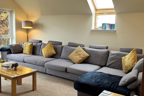 Spacious living room with plenty seating for the family