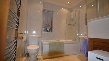 Combined shower/tub, hair dryer, towels, soap