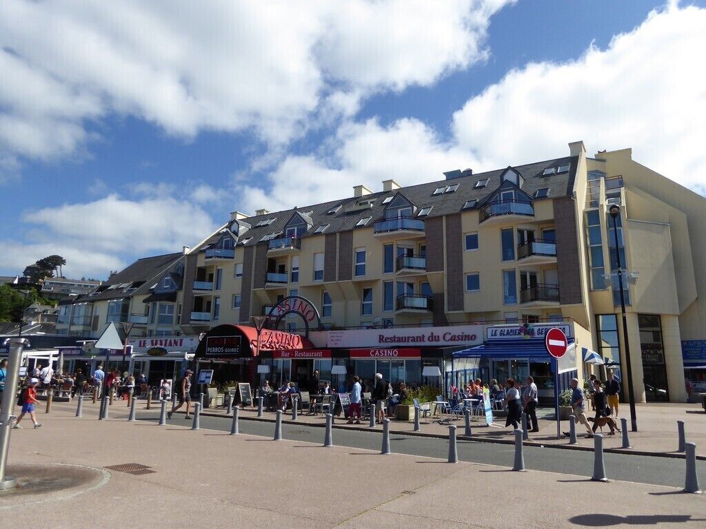 A multi-story building with a casino, restaurant, and bar.