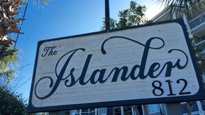 A sign with the text "The Islander 812" indicating a property or location. - Modern, Completely Renovated 2 bdrm 2 bath Ocean View (Surfside Beach)