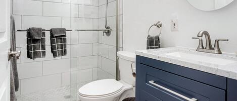 Combined shower/bathtub, hair dryer, towels, soap