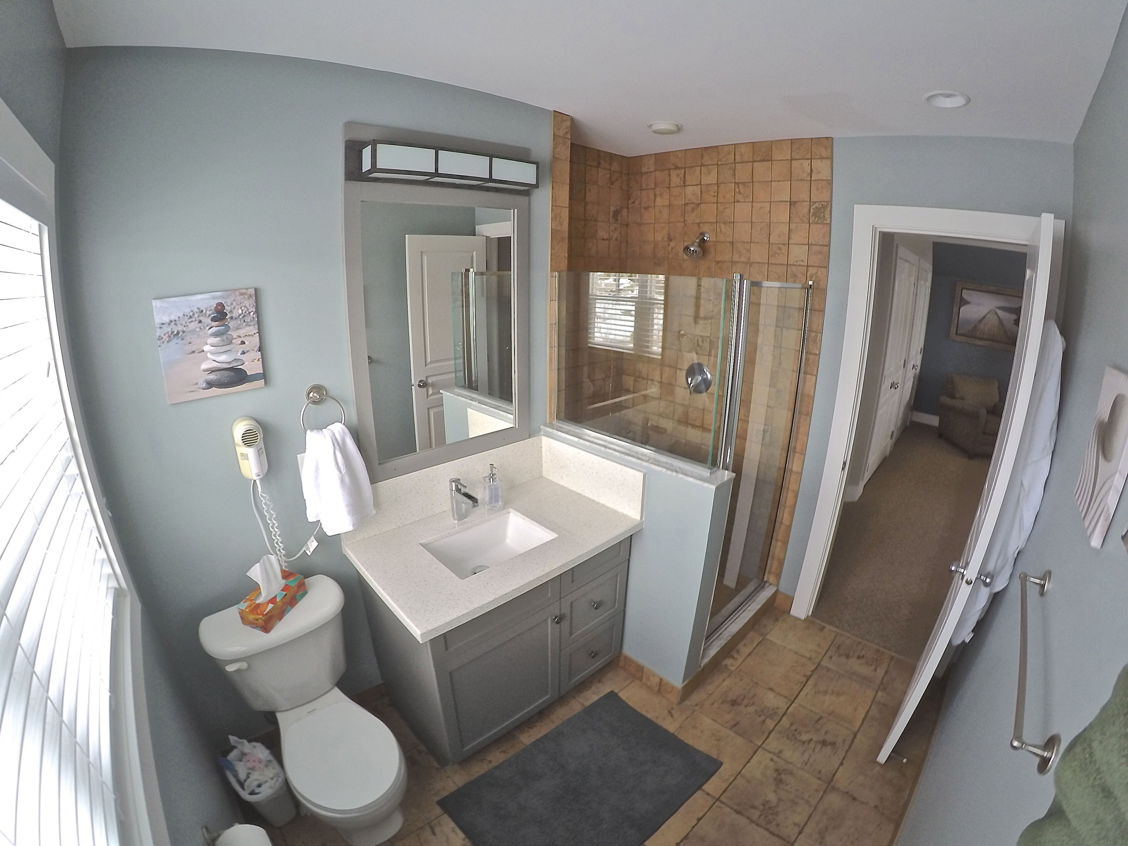 Combined shower/tub, hair dryer, towels, soap