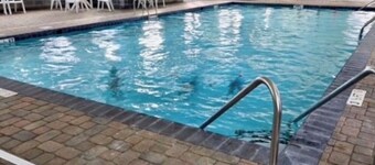 “Tiki time Getaway” -dog friendly, sleeps 6. Corner of splash pad and pool.