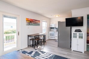 Enjoy meals at the dining table with four chairs, or relax in front of the flat-screen TV.