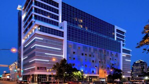 A modern hotel with a glass facade, multiple floors, and a prominent 'Aloft' sign. - Aloft by Marriott Buffalo Downtown (Buffalo)