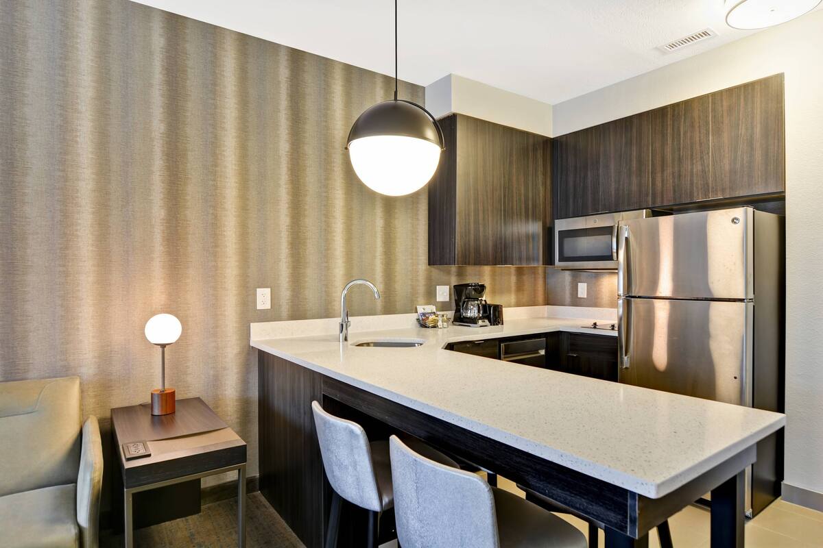 full-sized fridge, microwave, stovetop, dishwasher