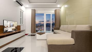 Apartment, 2 Bedrooms | Living room | Flat-screen TV