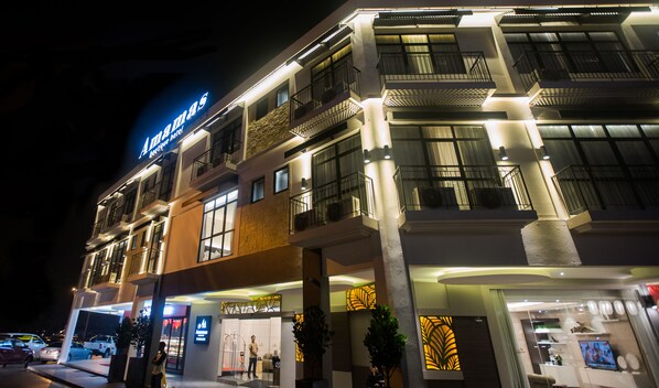 A multi-story hotel with a modern facade, balconies, and a visible sign for 'Ammas Boutique Hotel'. - Amamas Boutique Hotel Kuching (Kuching)