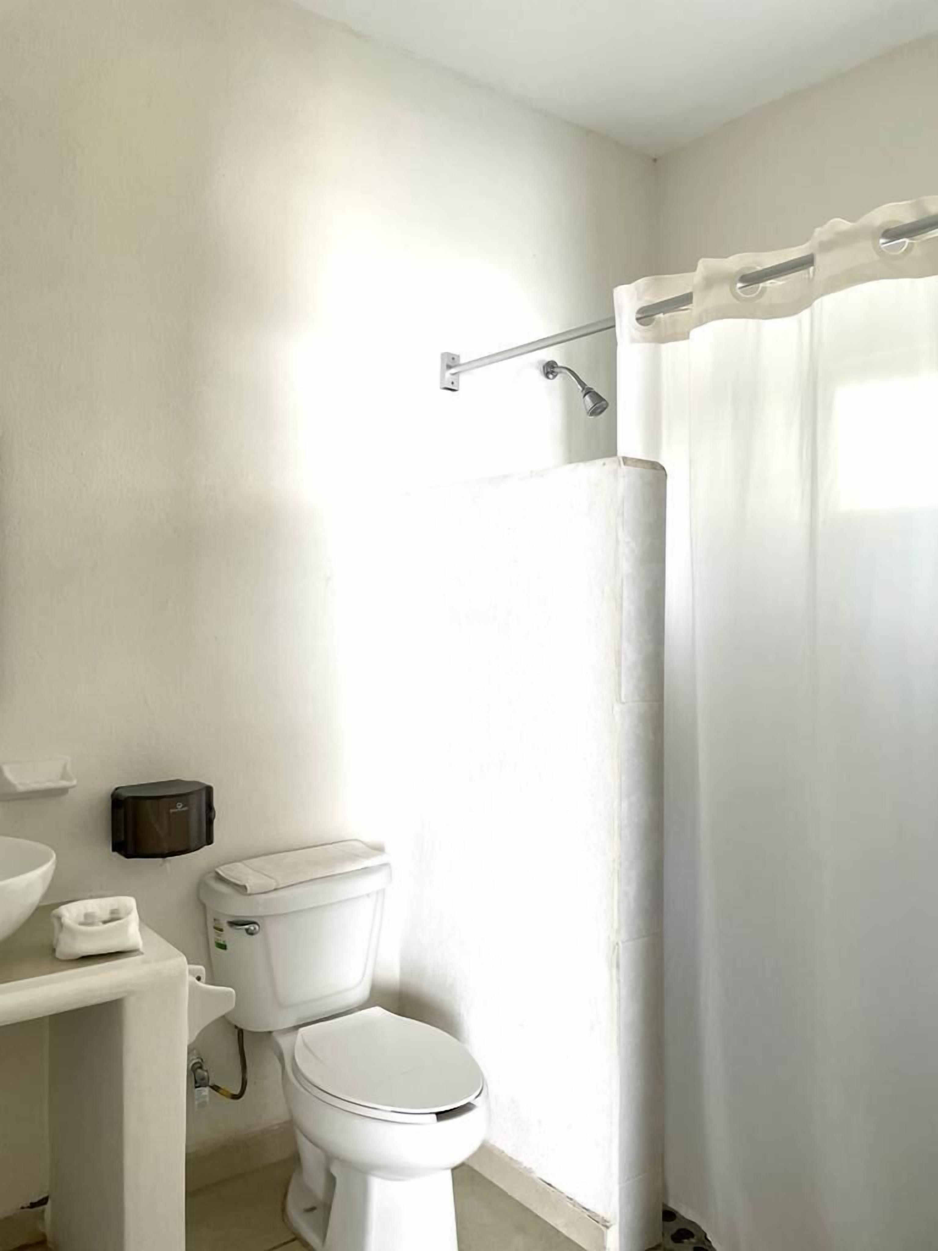 basic quadruple room, 2 double beds | 1 bedroom, minibar, blackout curtains, iron/ironing board