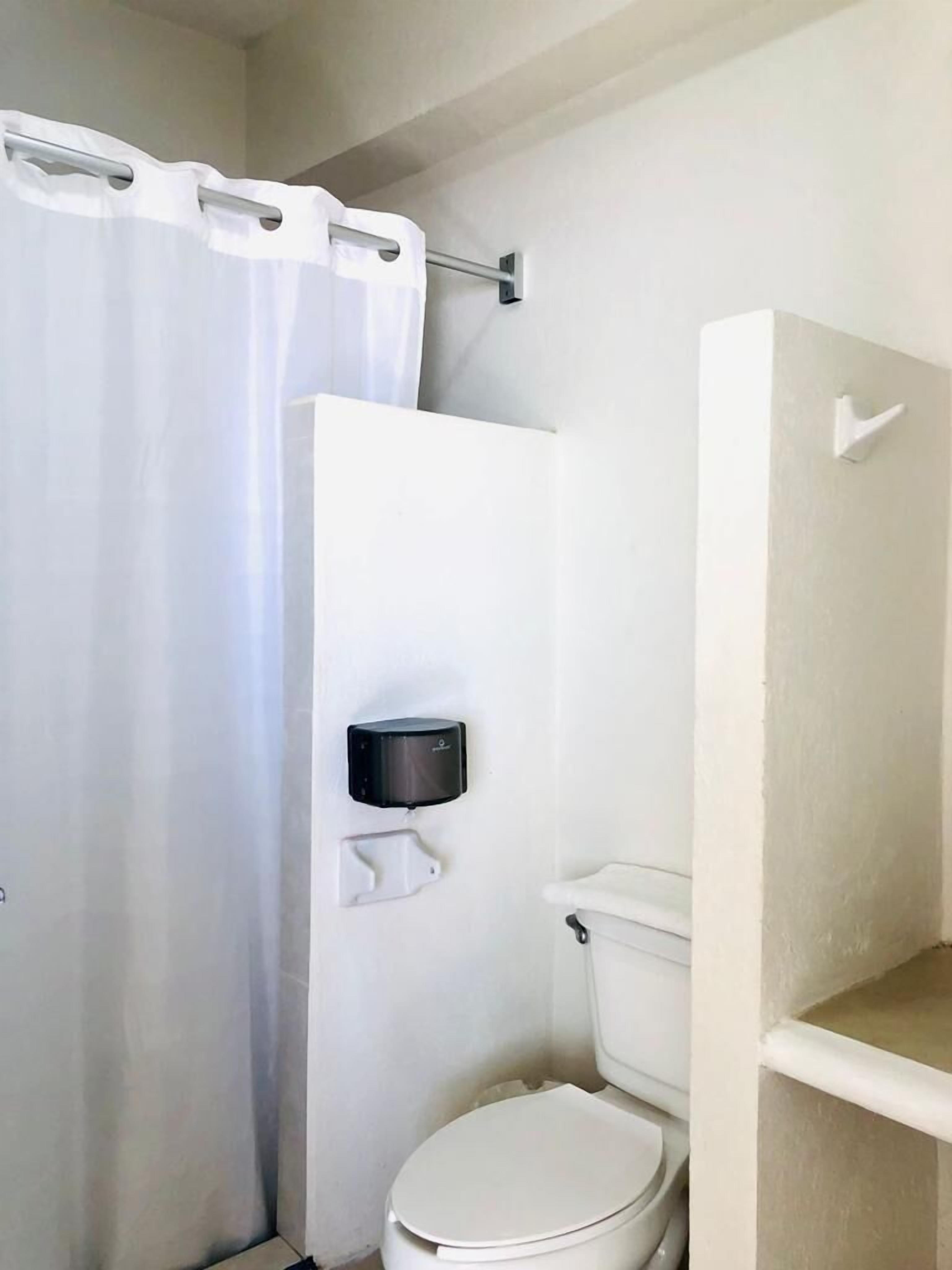 superior bungalow, kitchen, beach view (4 double beds ) | bathroom | towels, soap, shampoo, toilet paper