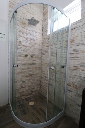 Shower, hair dryer, towels, soap