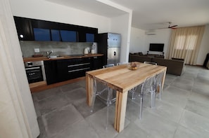 Luxury Apartment, 3 Bedrooms, Ocean View (Moja) | Private kitchen | Full-sized fridge, microwave, oven, stovetop - Amani Home Zanzibar (Kiwengwa)