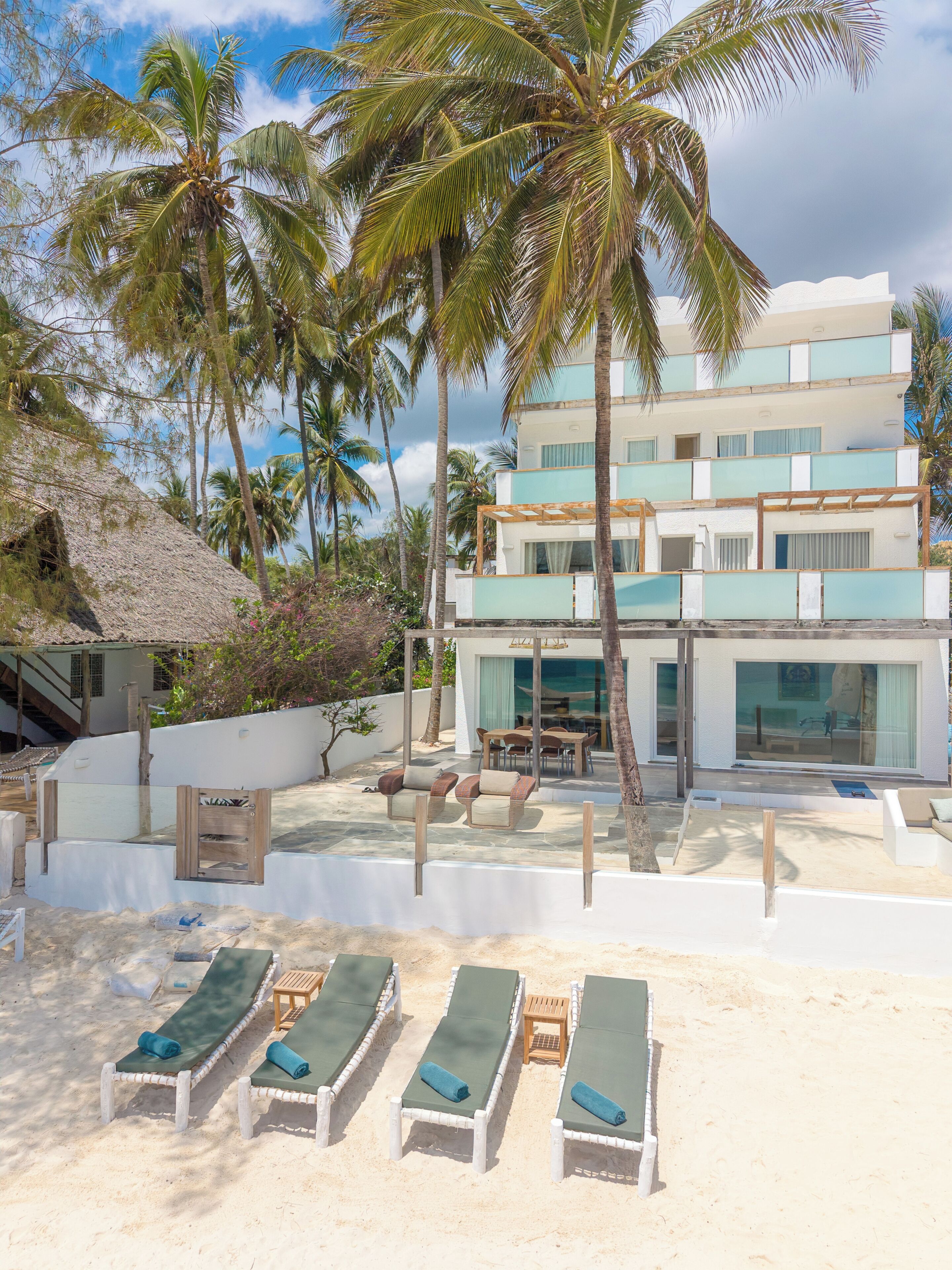 Private beach, white sand, sun loungers, beach umbrellas