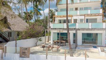 Private beach, white sand, sun loungers, beach umbrellas