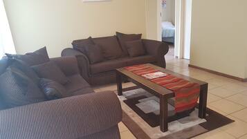 Family Apartment | Living area | 32-inch LCD TV with satellite channels, TV