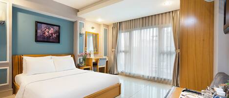 Habitación doble Deluxe, vista a la ciudad | Ropa de cama de alta calidad y minibar
