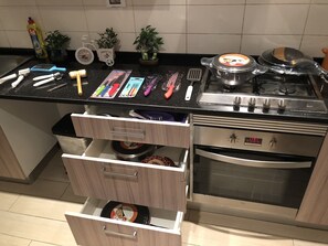 Apartment | Private kitchen | Full-sized fridge, microwave, oven, stovetop