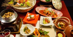 A variety of dishes on a table, including seafood, vegetables, and a bowl of soup. - Hakone Onsen Yuyado Yamanosyou (Hakone)