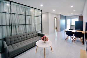 Family Apartment | Living area | 43-inch Smart TV with cable channels, TV - Anrizon Hotel Nha Trang (Nha Trang)